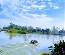 A calm river and green riverbank in Jhapa
